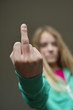 Girl showing middle finger
