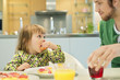 Man and daughter at breakfast table