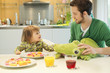 Man and daughter at breakfast table