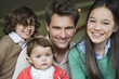 Portrait of a happy man with their children smiling