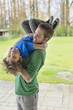 Man playing with his son in a park