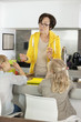 Elderly woman with her granddaughters in a kitchen