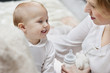 Woman playing with her daughter and smiling