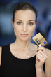 Portrait of a businesswoman holding a credit card