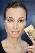 Portrait of a businesswoman holding a credit card