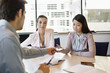 Business executive giving business card to his clients