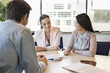 Business executive discussing with his clients