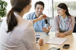 Couple receiving keys from business executive
