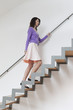Woman moving up stairs