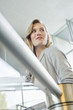 Businesswoman near staircase