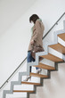 Woman moving down stairs