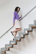 Woman moving up stairs