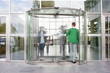Business executives at entrance of an office building