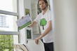 Foto: Man holding an ecological poster showing wind turbine Man holding an ecological poster showing wind turbine
