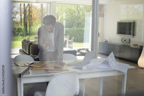 Photo: Interior designer working in the office Interior designer working in the office