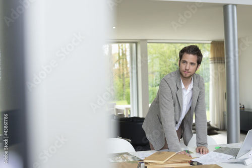 Photo: Interior designer working in the office Interior designer working in the office