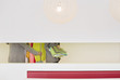 Mid section view of fashion designers with clothes rail in a corridor