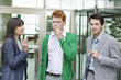 Business executives smoking in front of an office building