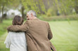 Man walking with his daughter in a park