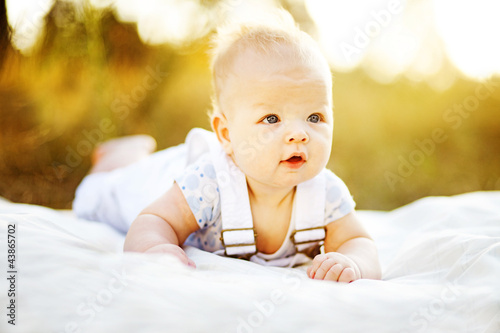 Photo: cute young mother with pretty infant son cute young mother with pretty infant son