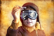 artistic portrait of child with former flight suit, with hat and