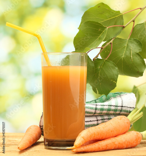 Photo: glass of carrot juice and fresh carrots glass of carrot juice and fresh carrots