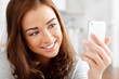 Photo: Pretty young woman using mobile phone Pretty young woman using mobile phone