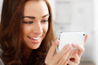 Photo: Pretty young woman using mobile phone Pretty young woman using mobile phone