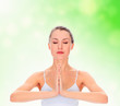 young girl practicing yoga, meditating in prayer pose