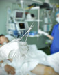 medical instrument in the hand against hospital ward with the pa