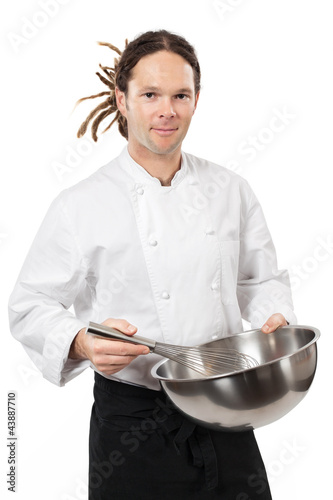 Photo: Young chef mixing with whisk Young chef mixing with whisk