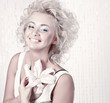 Photo: Beautiful smiling young female with original make up and flower Beautiful smiling young female with original make up and flower