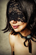 Sexy young woman with lace mask