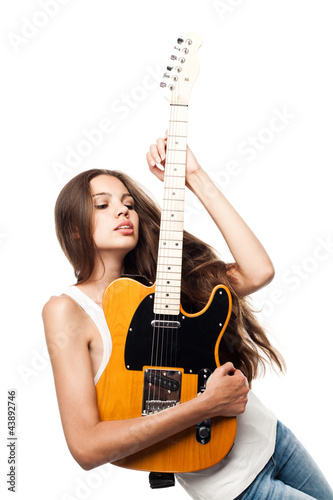 Photo: Beautiful young woman with electric guitar Beautiful young woman with electric guitar