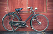 Vintage Bicycle standing near a vintage wood wall