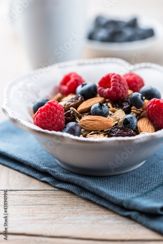 Photo: Muesli with fresh fruits, almonds and raisins Muesli with fresh fruits, almonds and raisins