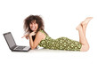 Foto: Beautiful girl with the laptop lies on a floor isolated on a wh Beautiful girl with the laptop lies on a floor isolated on a wh