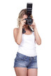 Photo: Cheerful woman shooting with a camera against white background Cheerful woman shooting with a camera against white background