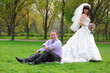 Foto: Happy groom and the bride in the park Happy groom and the bride in the park