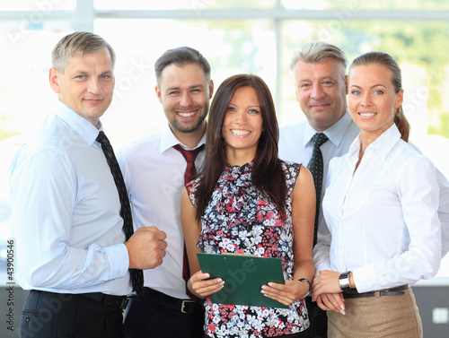 Photo: Successful business team laughing together Successful business team laughing together