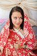 Young Indian girl in traditional red clothing