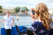 Photo: Woman photographing her girlfriend with simple camera Woman photographing her girlfriend with simple camera