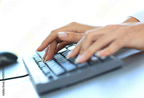 Photo: Close-up of typing female hands Close-up of typing female hands