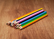 Assortment of colored pencils on wooden table