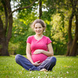 Photo: Beautiful pregnant woman in the park Beautiful pregnant woman in the park