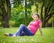 Photo: Beautiful pregnant woman in the park Beautiful pregnant woman in the park