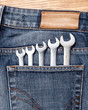 Wrenches in blue jeans pocket