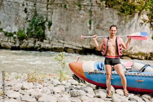 Photo: water rafting, young man and raft boat water rafting, young man and raft boat