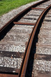 Tram rail road track disappearing around a curve