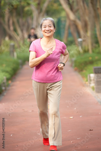 Photo: Senior Chinese Woman Jogging In Park Senior Chinese Woman Jogging In Park